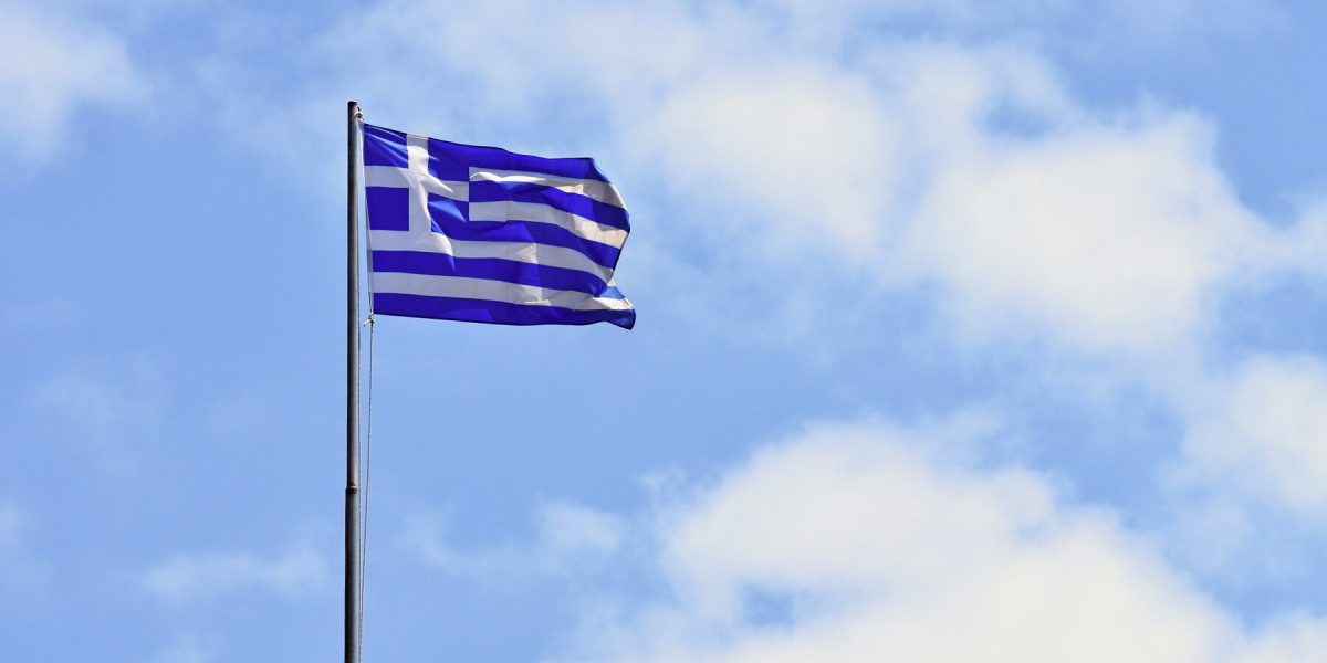 flag-greece-flying-wind-blue-sky-summer-background-travel-holidays-greece-crete_1161-704